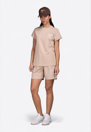 Model wearing beige T-shirt, full front view – East Vibe